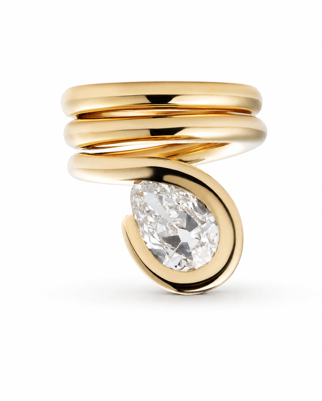 A gold wrap ring featuring a large pear-cut clear gemstone, photographed on a clean white background.