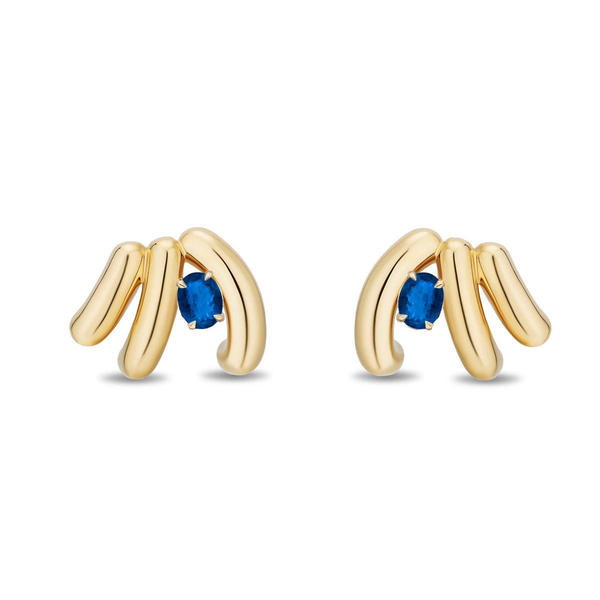 A pair of gold post earrings with three curved gold bars and a small oval blue sapphire in the center, shown on a plain white background.
