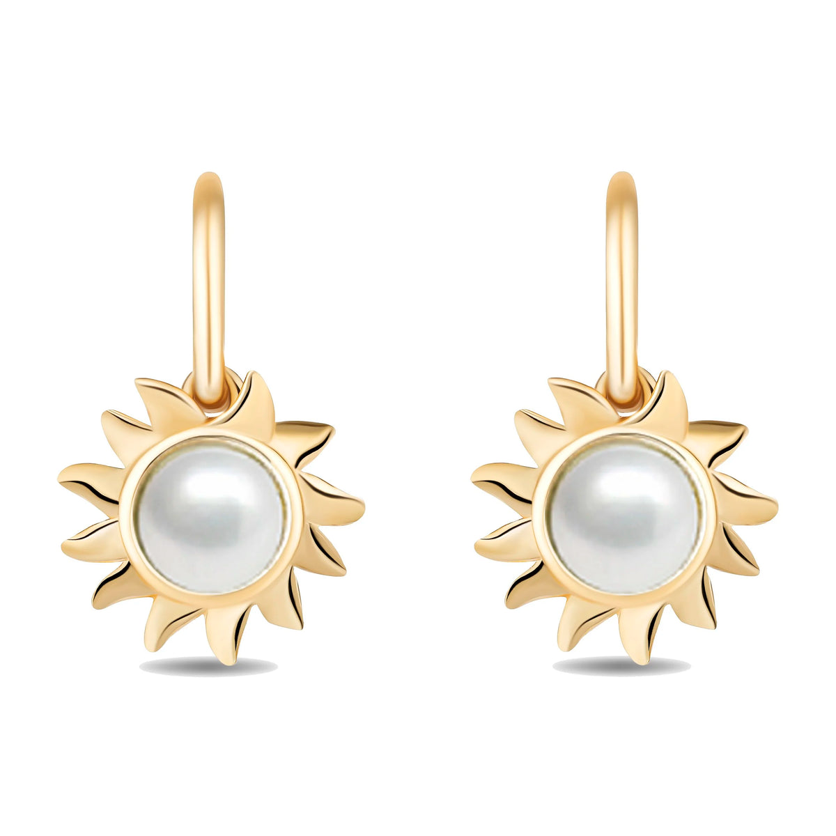 A pair of gold drop earrings featuring a stylized sunburst design with a central white pearl, shown on a clean white background.