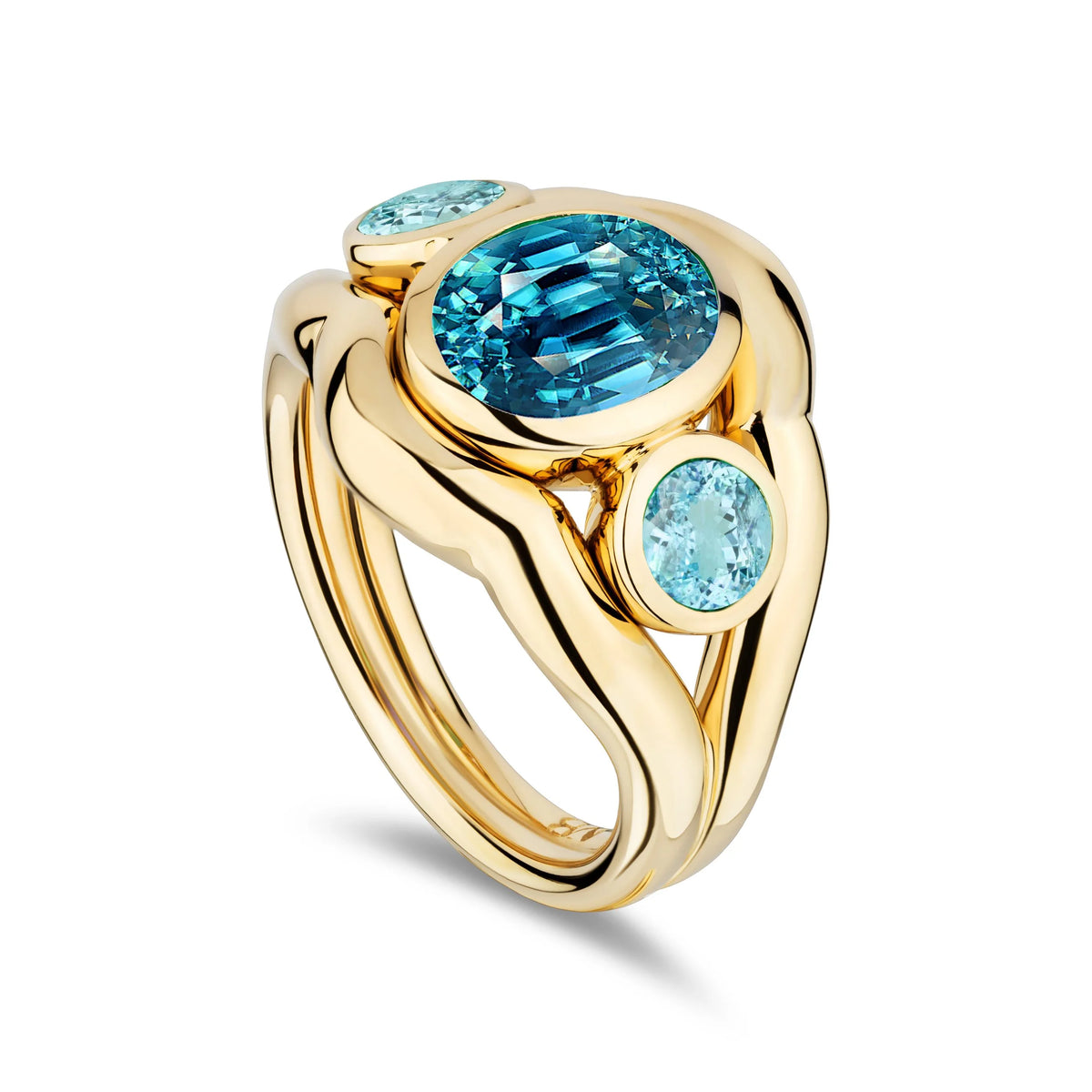 A gold ring featuring a large oval-cut light blue gemstone in the center, with two smaller round-cut light blue gemstones on either side, set in a polished yellow gold band against a white background.