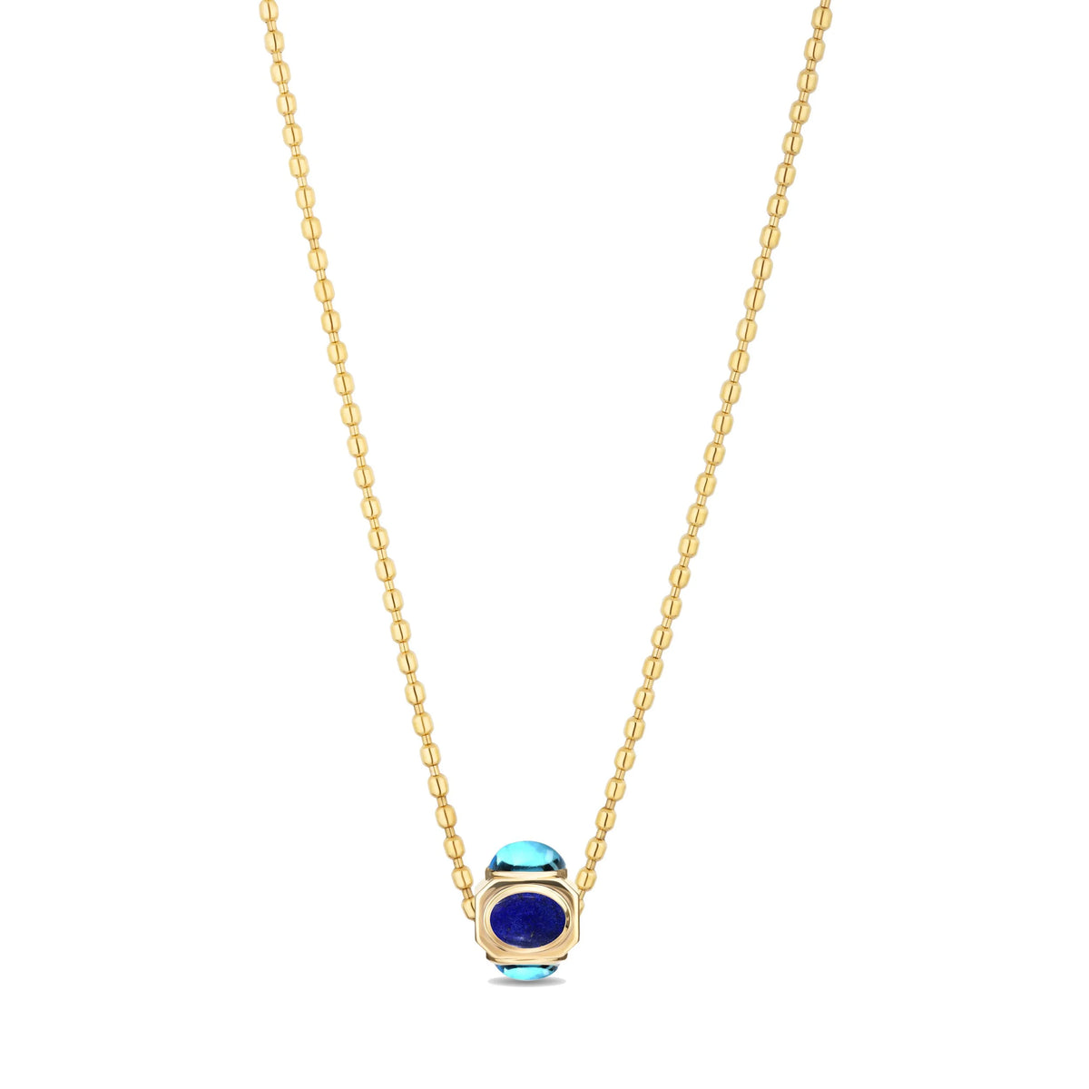 A gold chain necklace featuring a small pendant with a deep blue oval stone and light blue accent stones, set in a gold bezel, shown against a plain white background.