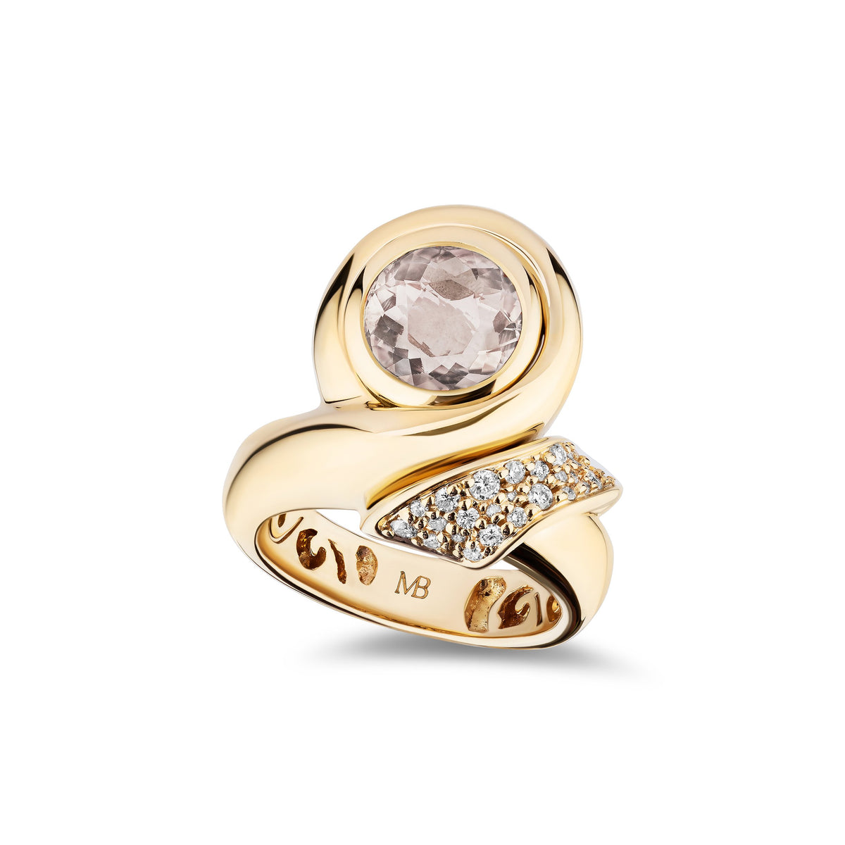 A gold ring with a round pale pink gemstone and a curved pavé diamond accent band, shown on a clean white background.