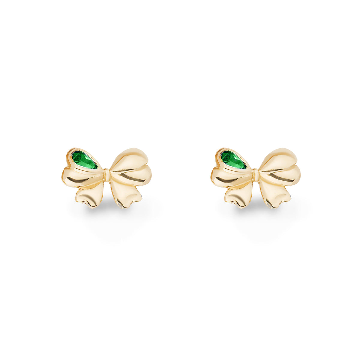 A pair of gold bow stud earrings with a small green emerald-cut accent on the left side of each bow, shown on a clean white background.