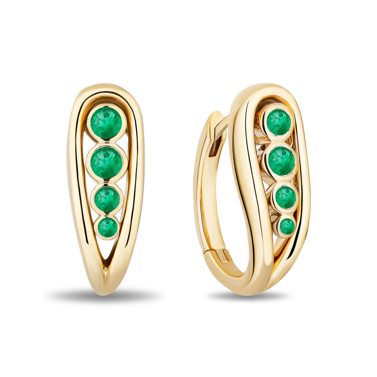 A pair of gold huggie hoop earrings with a vertical row of round emerald gemstones, shown on a clean white background.