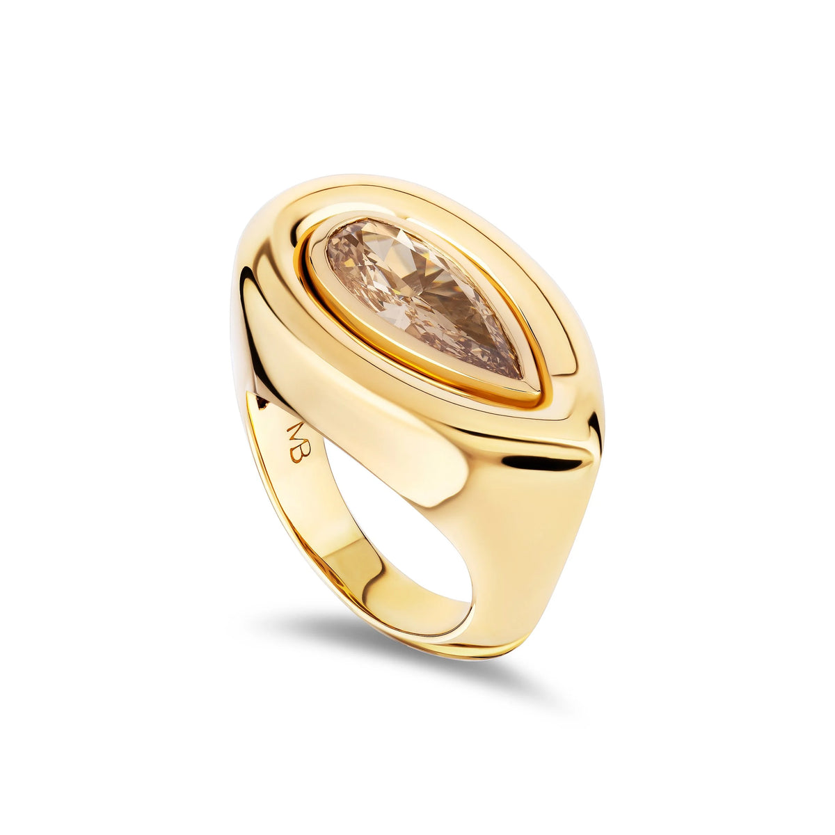 A polished yellow gold signet ring featuring a marquise-cut champagne-colored gemstone in a bezel setting, shown on a clean white background with a soft shadow.