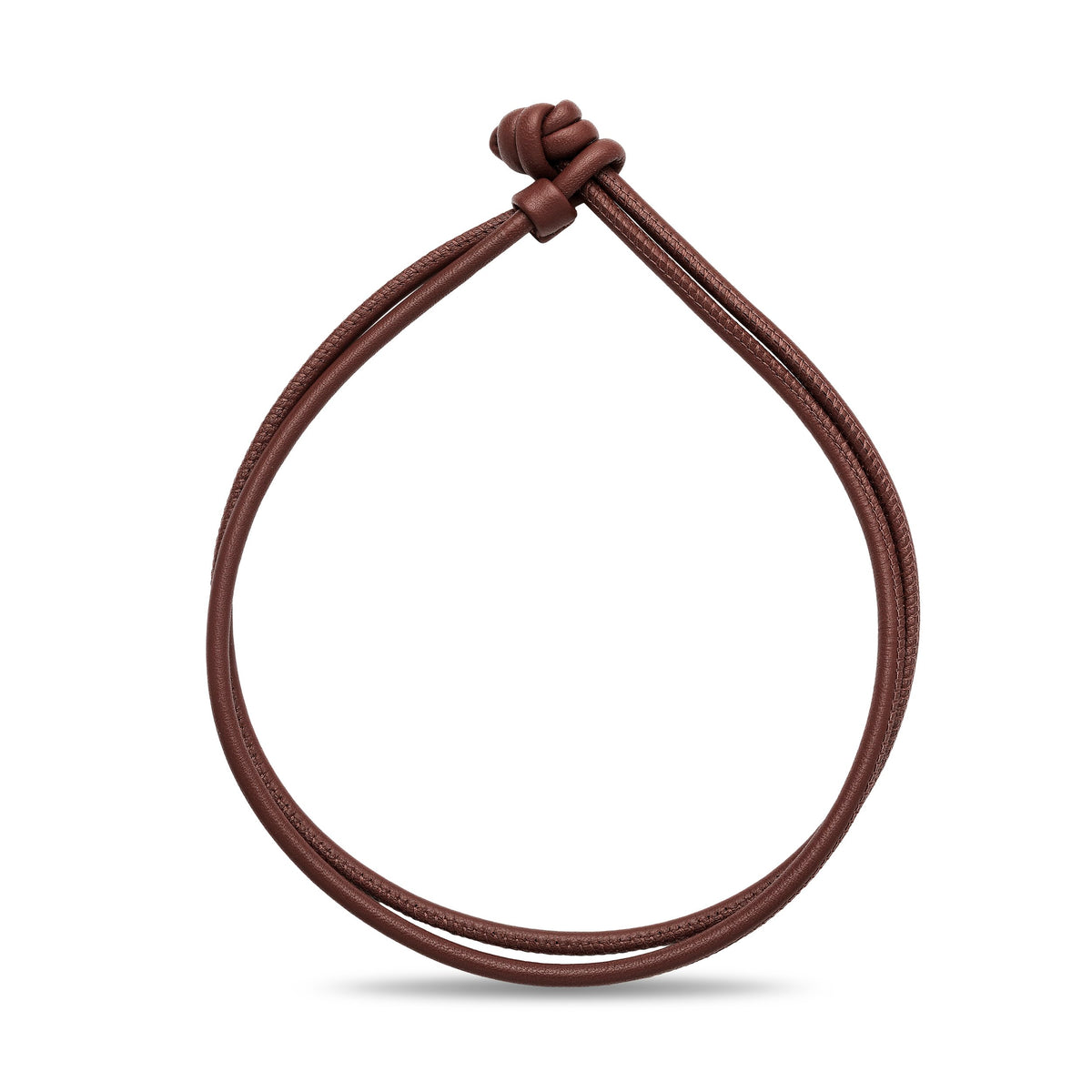 Brown leather cord bracelet on a white background