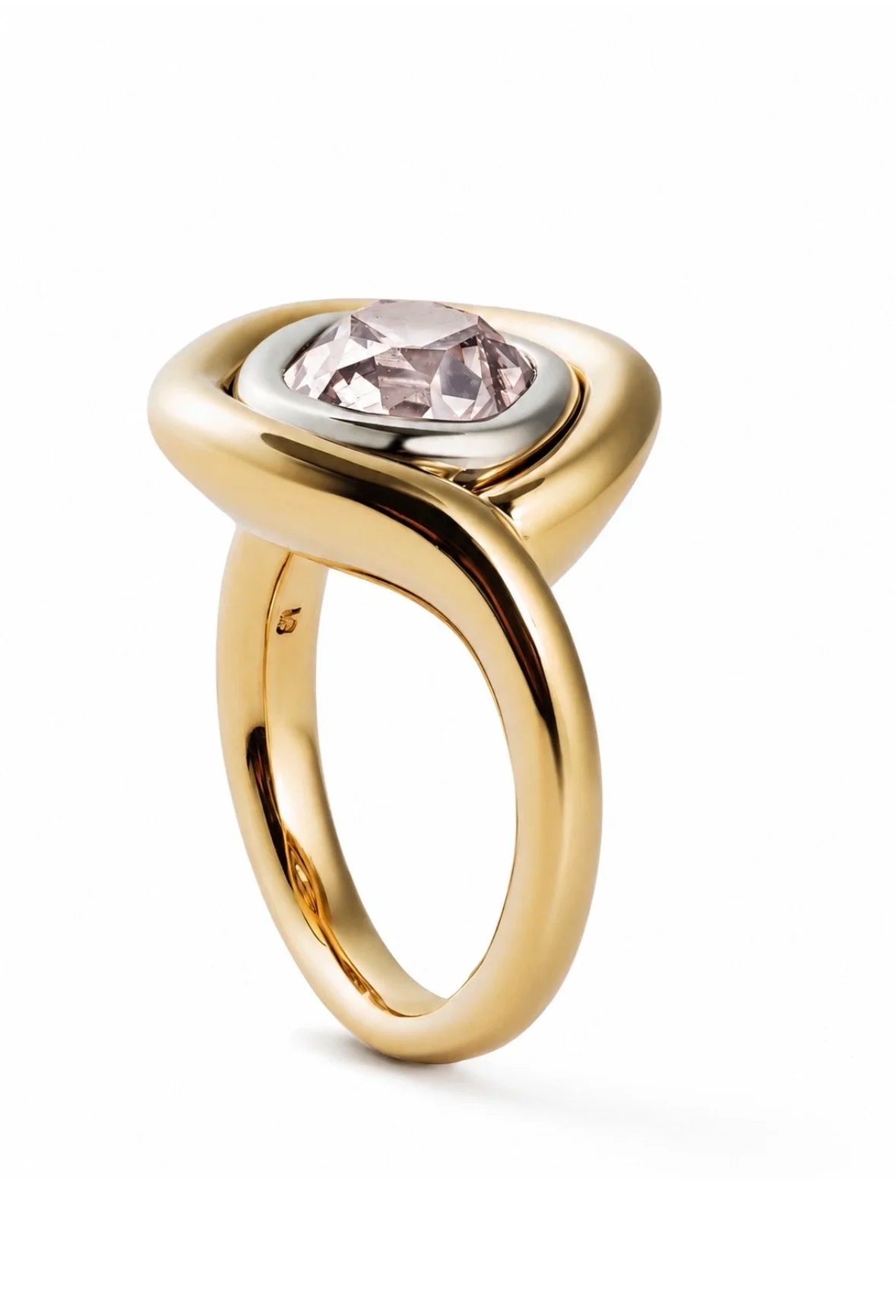 A gold ring with a unique twisted band and a bezel-set light pink gemstone, shown on a clean white background.