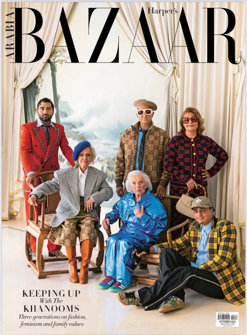 Fashionably dressed family members pose for a photo on the cover of Harper's Bazaar magazine, October 2022.