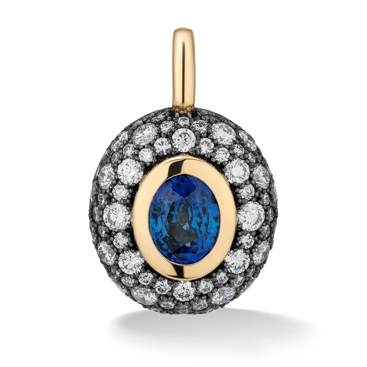 A luxury oval pendant featuring a central oval-cut blue sapphire surrounded by a gold bezel and a halo of small black and white diamonds, set on a white background with a soft shadow.