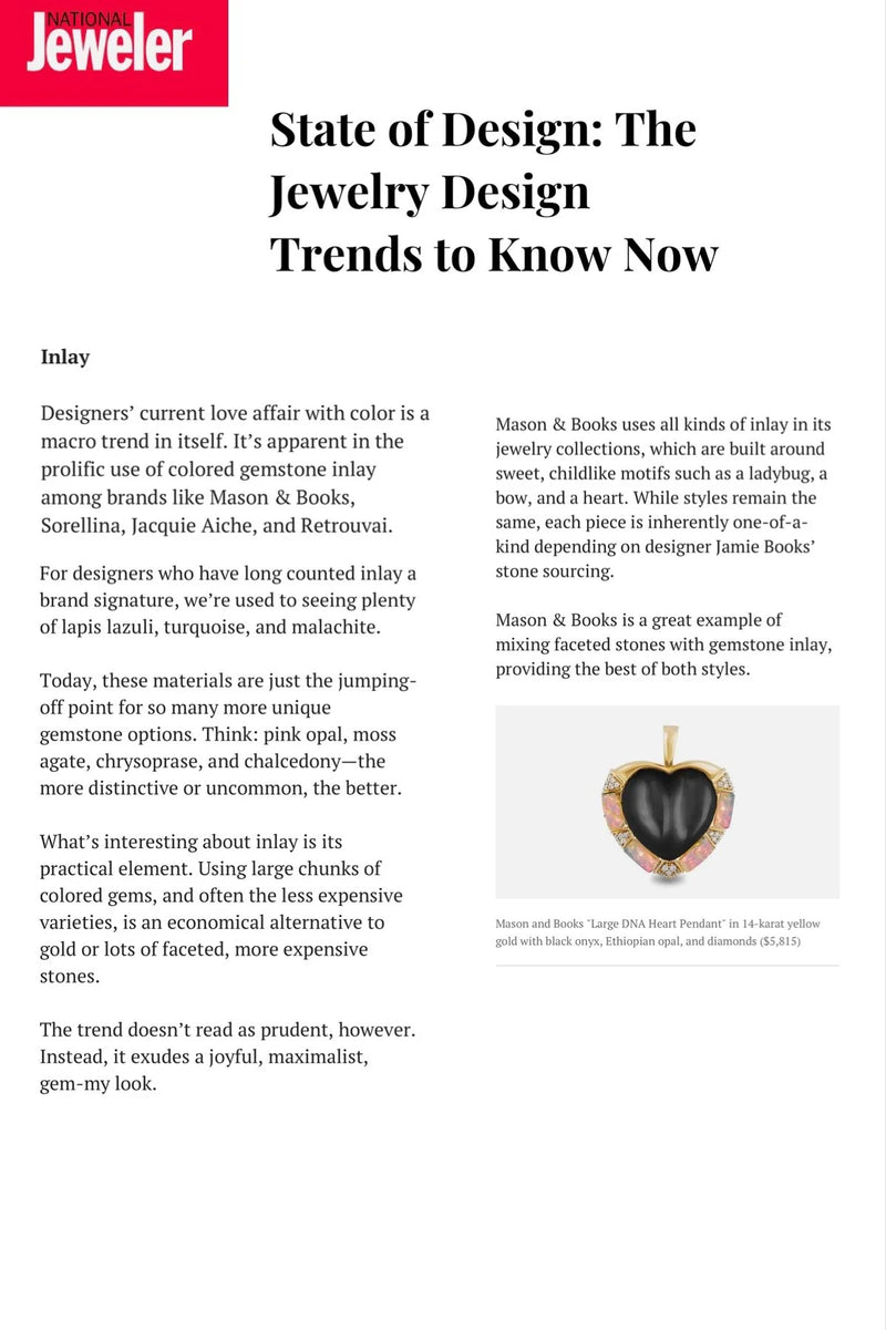 Page from National Jeweler magazine featuring a large DNA Heart Pendant with a black onyx heart, priced at $5,815.