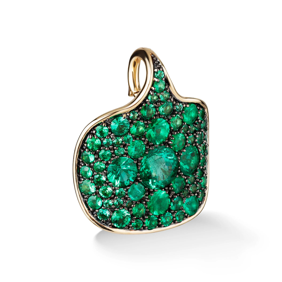A gold pendant featuring a cluster of round green emerald-cut gemstones and small black stones, set against a clean white background.