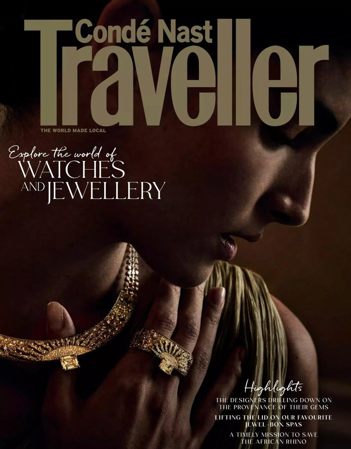 Cover of Conde Nast Traveler magazine featuring a woman wearing gold jewelry.