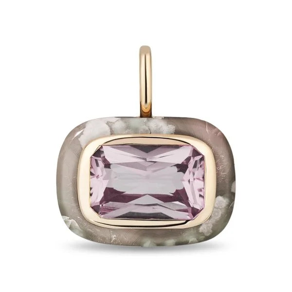 A rectangular pendant featuring a faceted light pink gemstone in a gold bezel setting, surrounded by a textured gray agate-like border with a gold bail, shown on a white background.