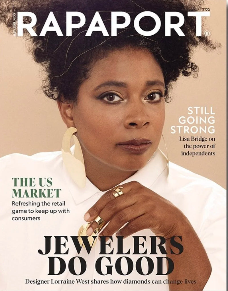 Cover of Rapaport magazine featuring a woman with curly hair, gold earrings, and rings.