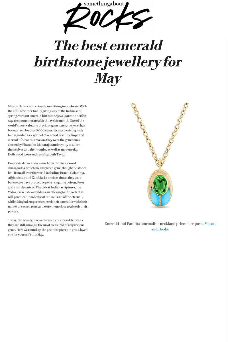 A webpage with text about emerald birthstone jewelry for May, featuring a gold necklace with an emerald and turquoise pendant.