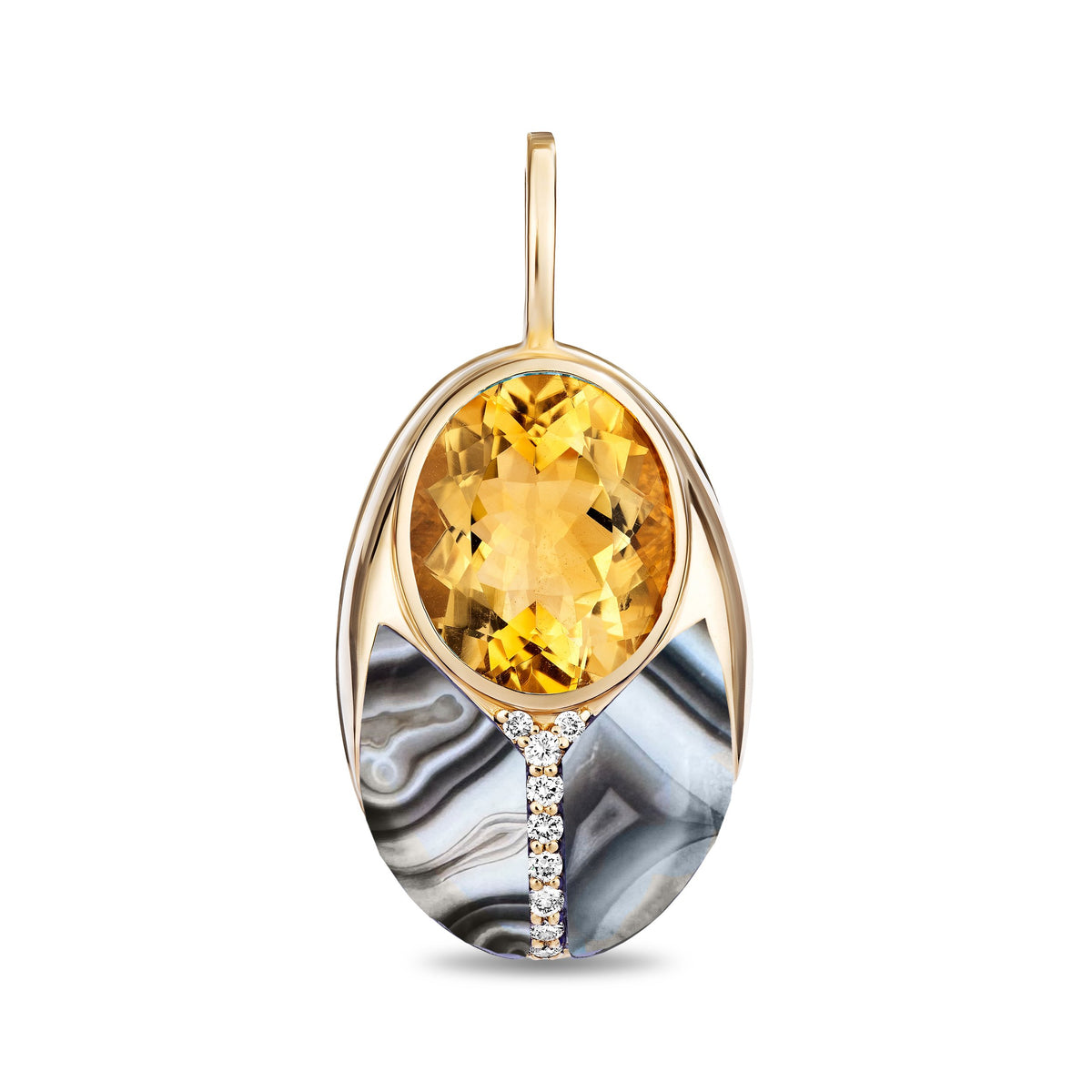 An oval pendant featuring a large faceted yellow citrine gemstone at the top, set in a polished gold-tone frame. The lower half of the pendant is decorated with a curved black and white agate inlay, accented by a small vertical line of clear pavé diamonds near the bottom center.