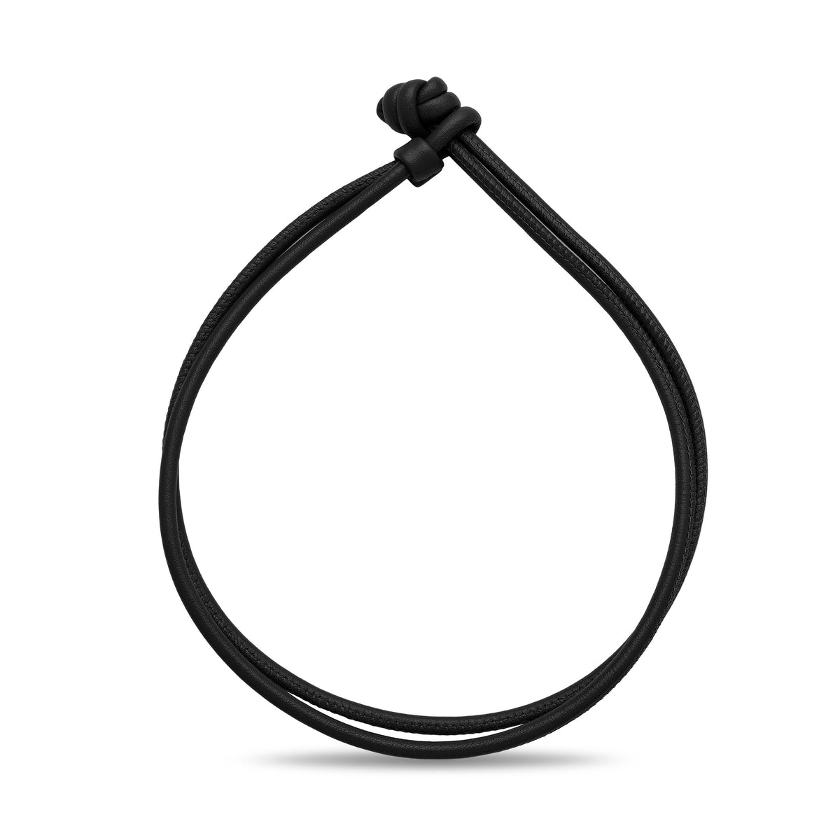 Brown leather cord bracelet on a white background