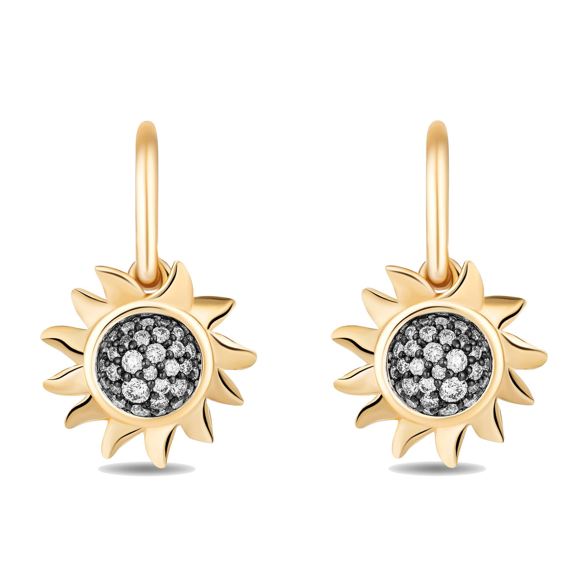A pair of gold sunburst drop earrings with pavé-set black and white stones in the center, shown on a clean white background.