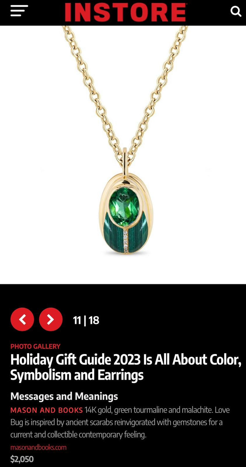 Gold necklace with a pendant featuring a green tourmaline and malachite stones, with small diamonds.