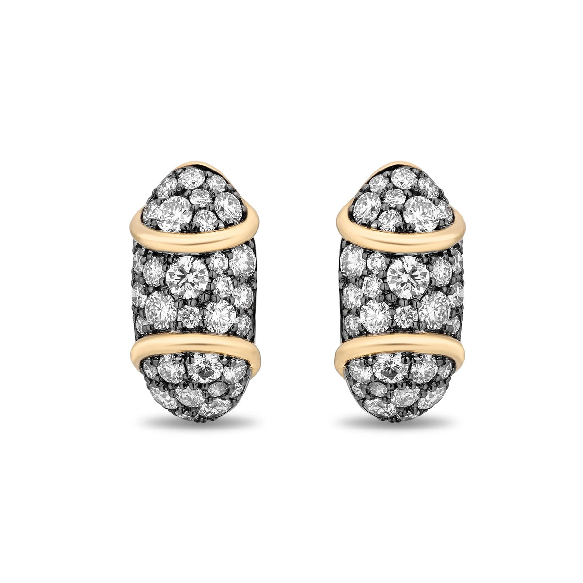 A pair of pavé diamond huggie hoop earrings in yellow gold and blackened silver-tone metal, shown on a clean white background.