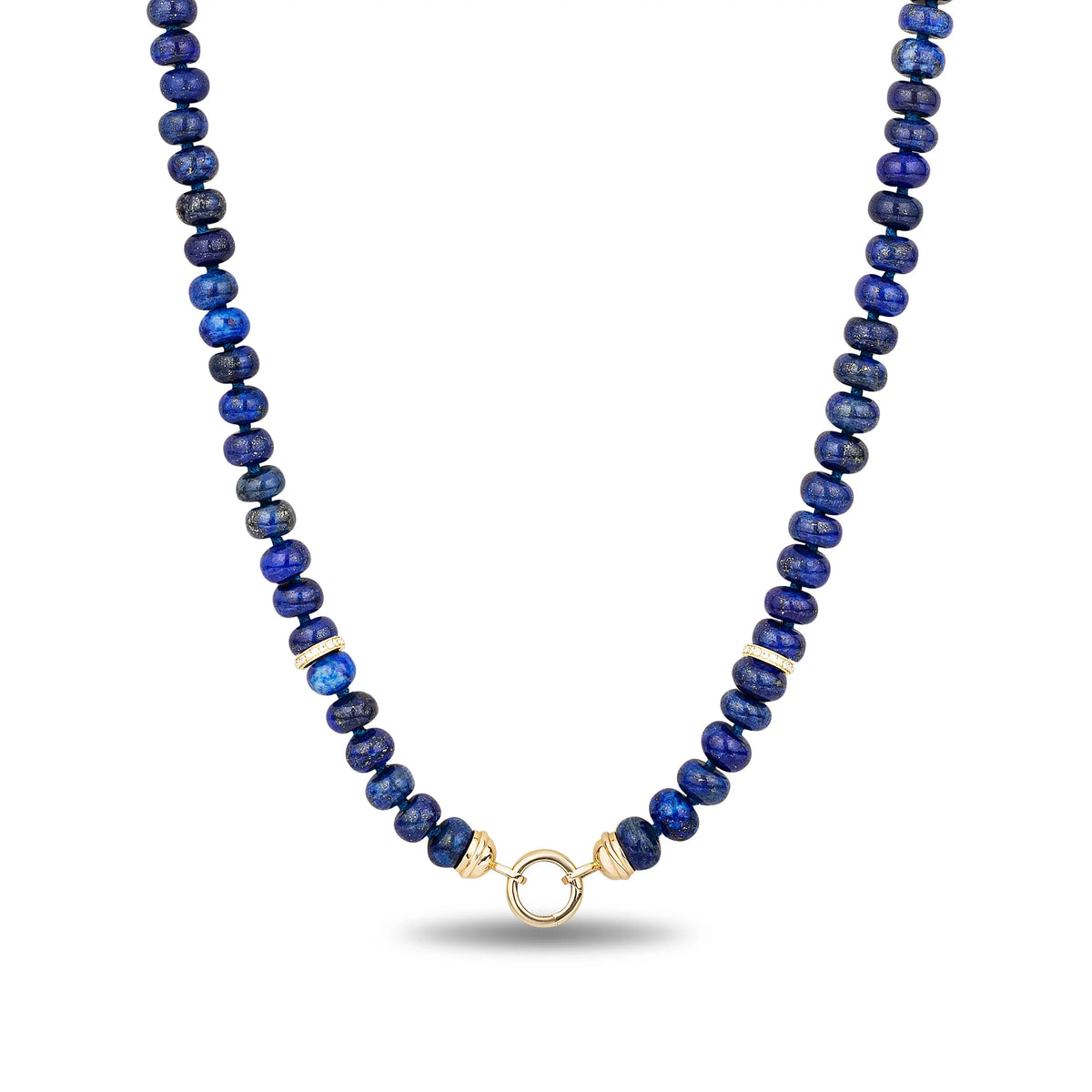 A beaded necklace made of deep blue lapis lazuli stones with small gold spacer beads and a gold clasp, shown on a clean white background.