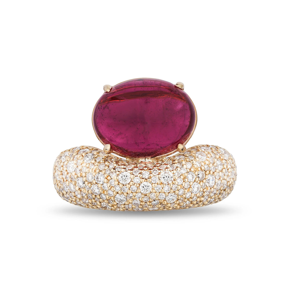 A yellow gold ring featuring a large oval-cut magenta-pink gemstone on top of a pavé-set band of small clear stones, shown against a plain white background.