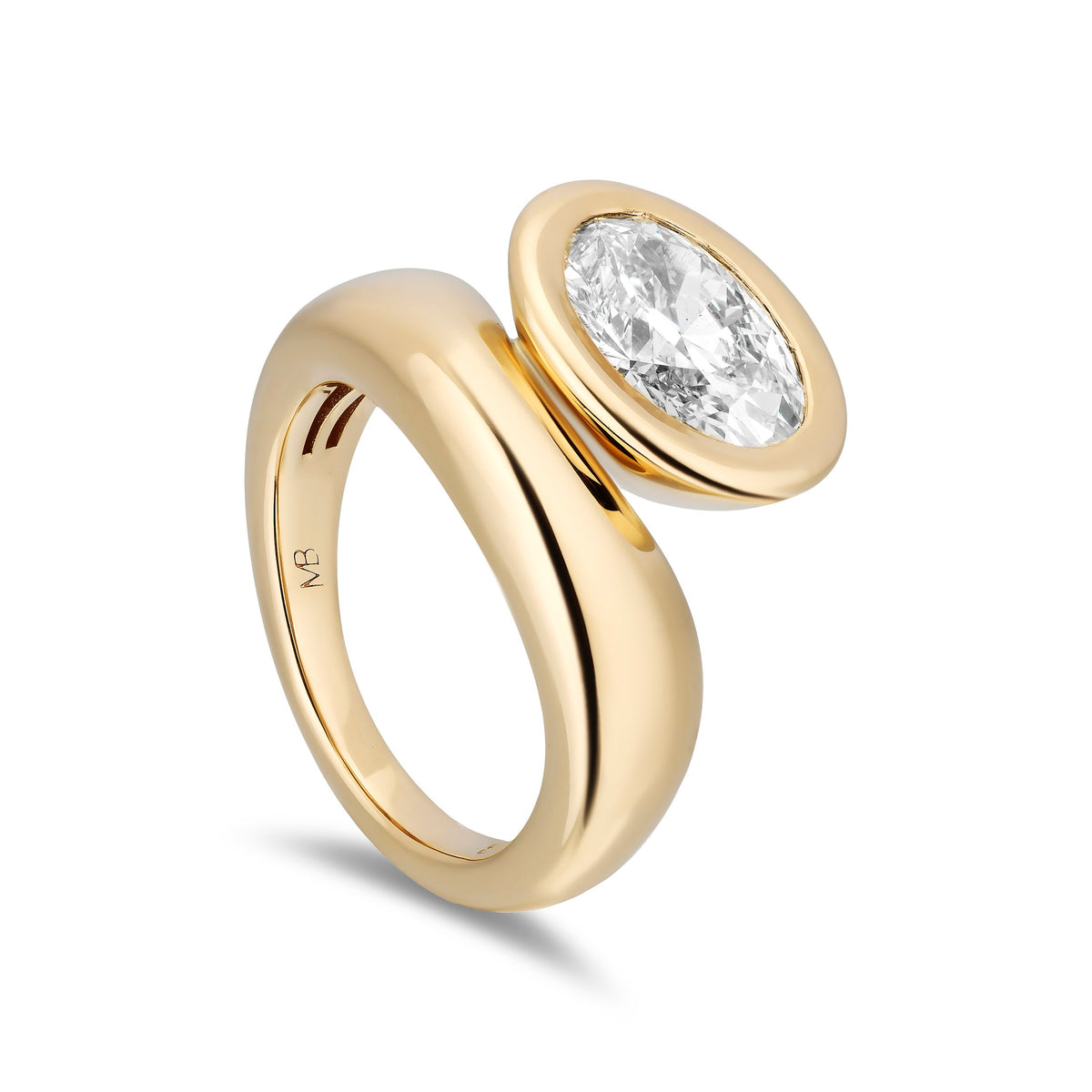 A polished yellow gold ring featuring a bezel-set oval diamond, shown on a clean white background with a soft shadow.