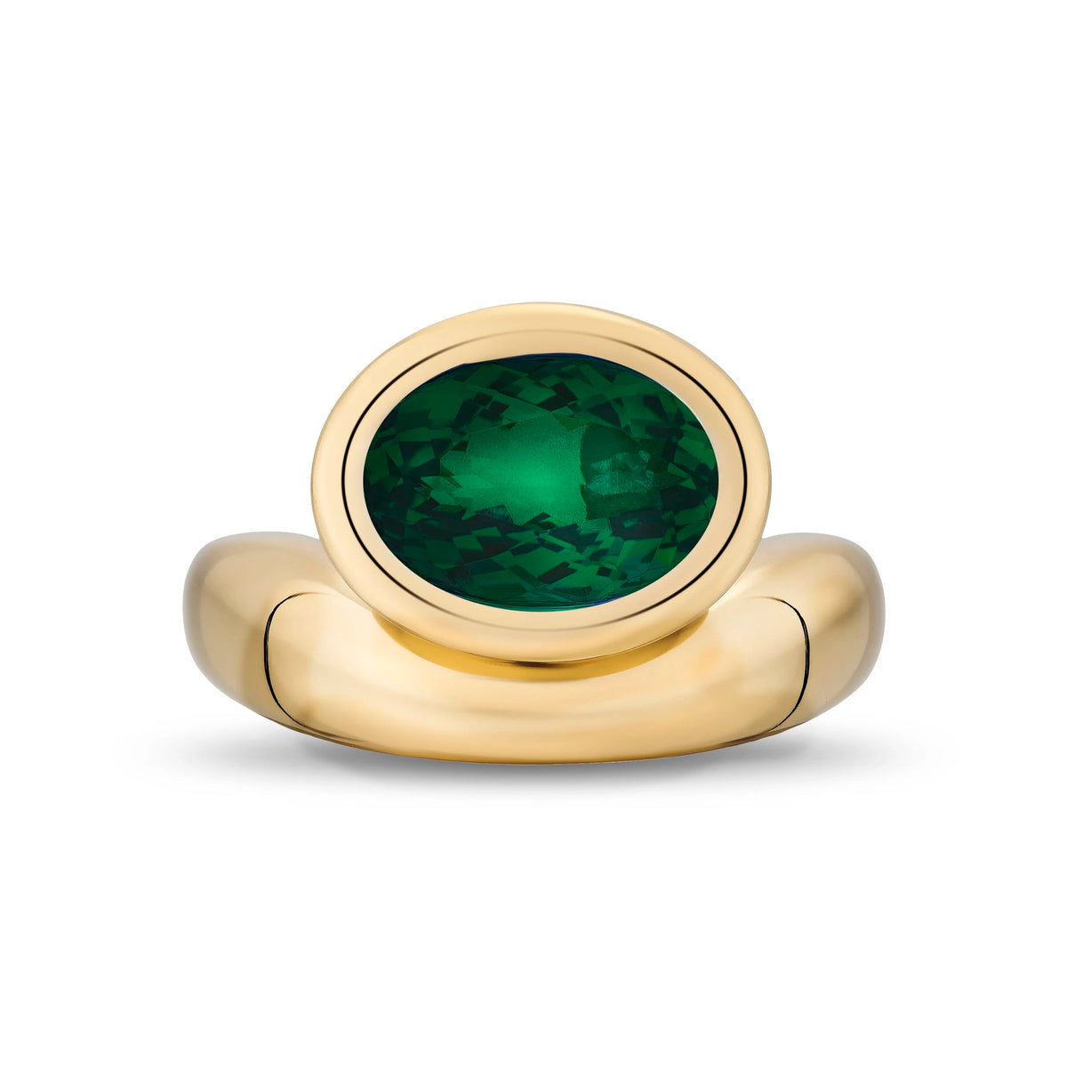 A gold signet-style ring featuring an oval-cut green tourmaline gemstone, shown on a clean white background.