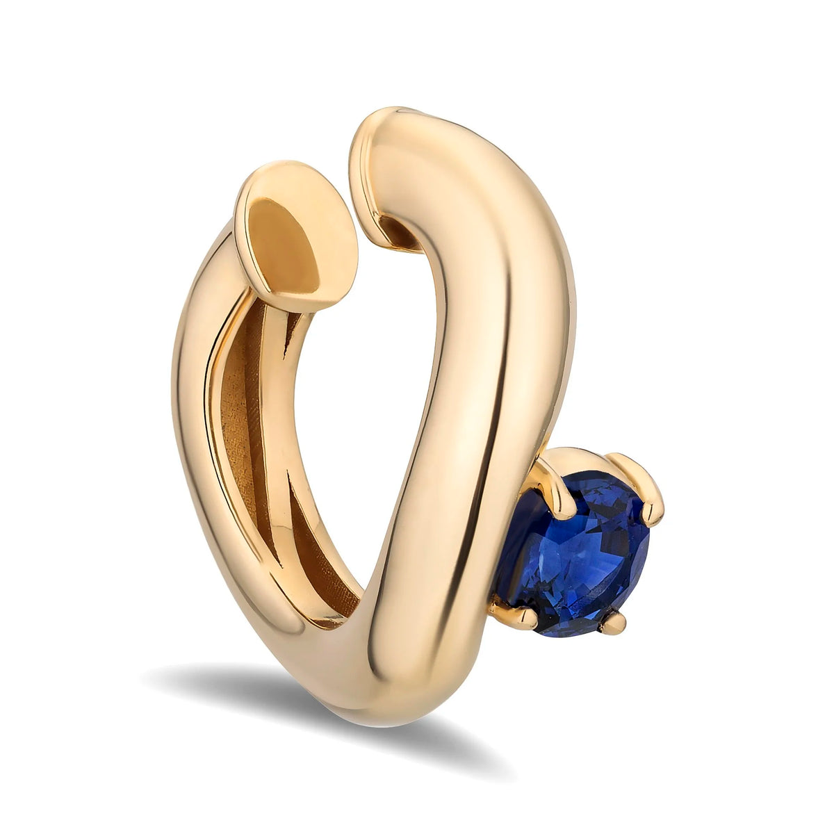 A polished yellow gold huggie hoop earring featuring a round-cut deep blue sapphire gemstone in a prong setting, shown on a clean white background.