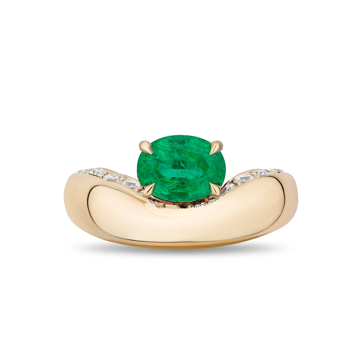 A yellow gold ring featuring a cushion-cut green emerald center stone and pavé-set diamonds along the curved band, shown on a plain white background.