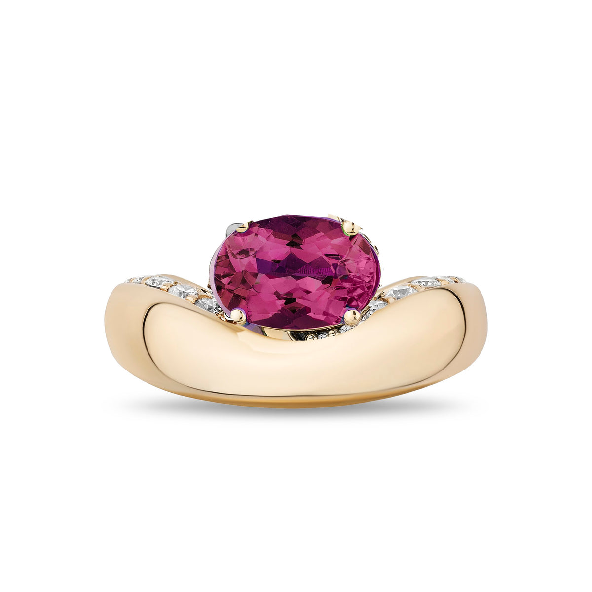 A yellow gold ring featuring a large oval-cut magenta-pink gemstone in a prong setting, with small clear stones along the curved shoulders of the band, shown on a plain white background.