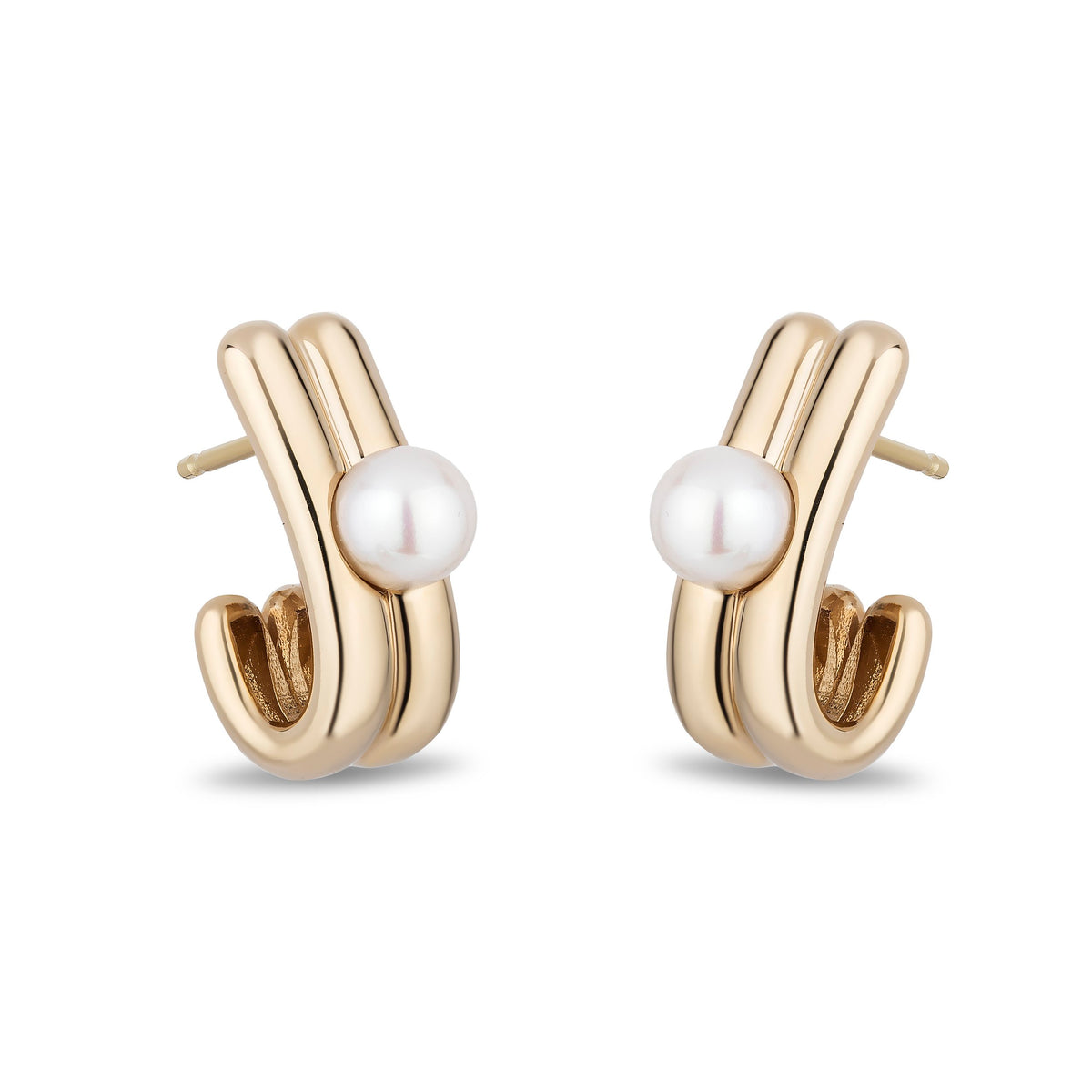 A pair of gold huggie hoop earrings with a white freshwater pearl set in the center of each earring, shown on a clean white background.