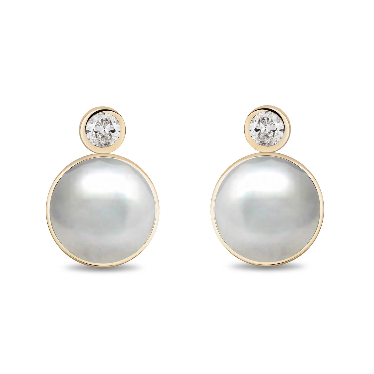 A pair of gold stud earrings featuring a large round white pearl and a small round clear diamond in a gold bezel setting above it, shown on a plain white background.