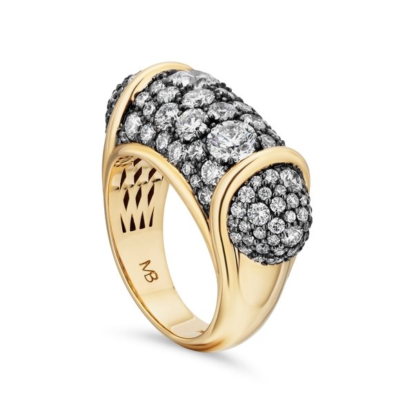 A yellow gold ring with pavé-set diamonds in a curved, multi-domed design, shown on a clean white background. The inner band is engraved with 'MB'.